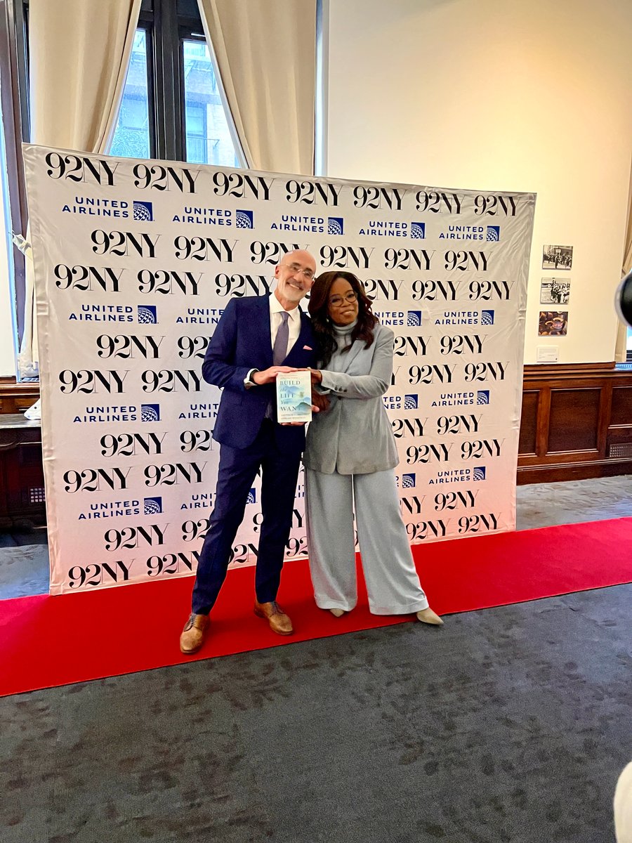 Oprah and Arthur Brooks pose for a photo with their new book, Build The Life You want
